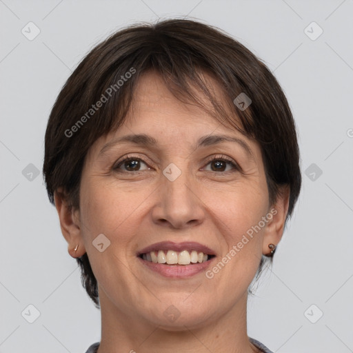 Joyful white adult female with medium  brown hair and grey eyes