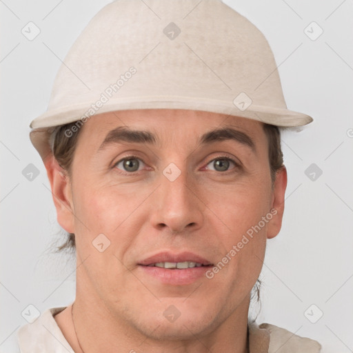 Joyful white adult male with short  brown hair and grey eyes