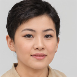 Joyful asian young-adult female with short  brown hair and brown eyes