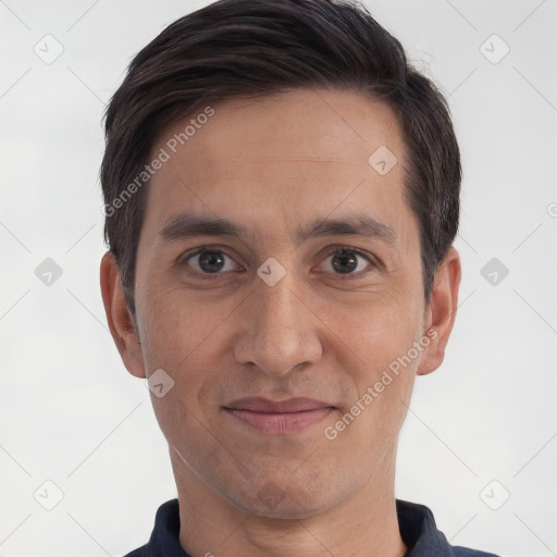 Joyful white adult male with short  brown hair and brown eyes