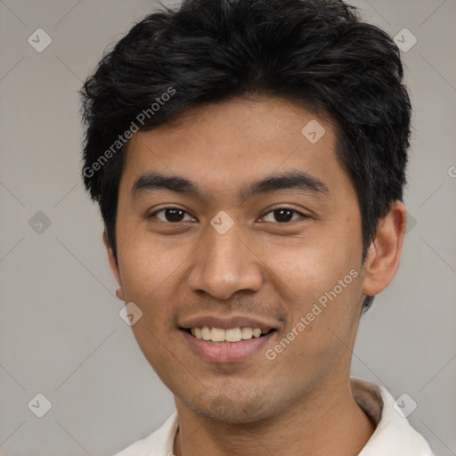 Joyful latino young-adult male with short  black hair and brown eyes