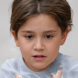 Joyful white child female with short  brown hair and brown eyes