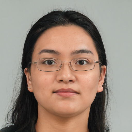 Joyful white young-adult female with long  black hair and brown eyes