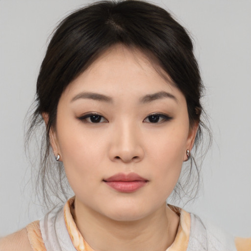 Neutral asian young-adult female with medium  brown hair and brown eyes