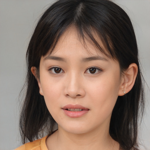 Neutral asian young-adult female with medium  brown hair and brown eyes