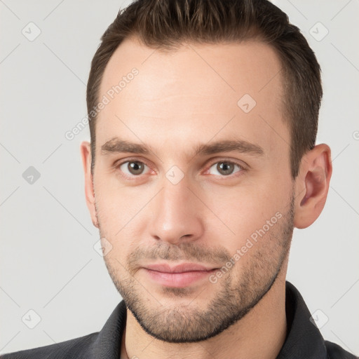 Neutral white young-adult male with short  brown hair and grey eyes