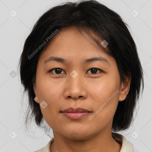 Joyful asian young-adult female with medium  brown hair and brown eyes