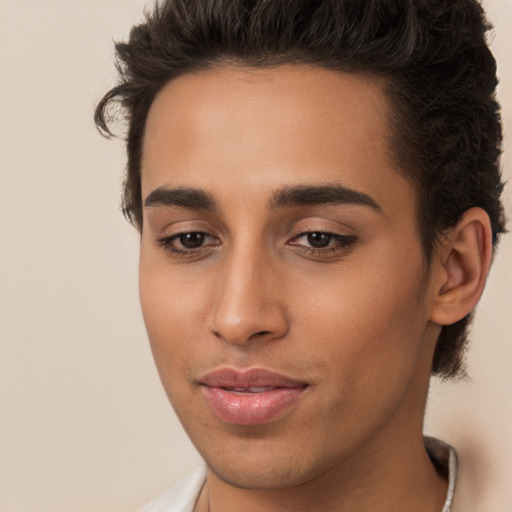 Joyful white young-adult male with long  brown hair and brown eyes