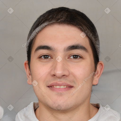 Joyful white young-adult male with short  black hair and brown eyes