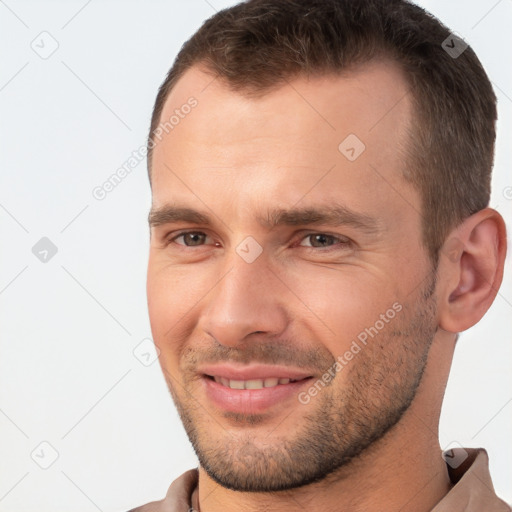 Joyful white young-adult male with short  brown hair and brown eyes