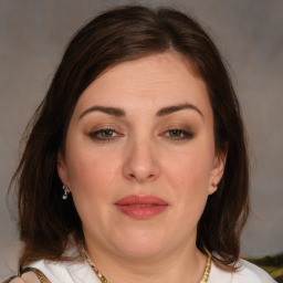 Joyful white young-adult female with medium  brown hair and brown eyes