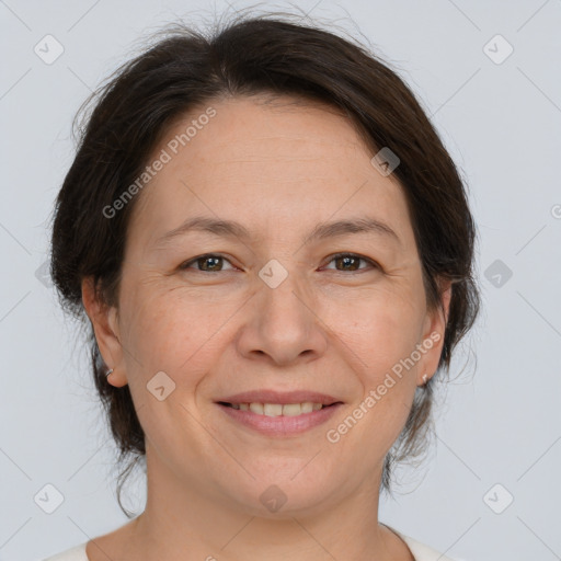 Joyful white adult female with medium  brown hair and brown eyes