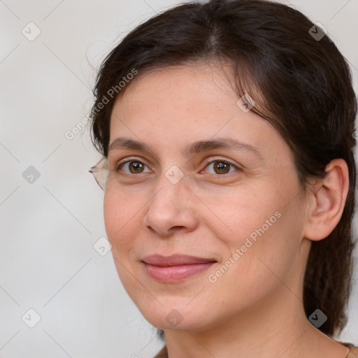 Joyful white adult female with medium  brown hair and brown eyes