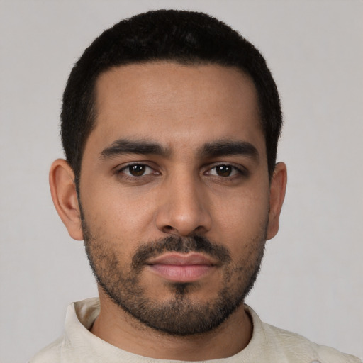 Neutral latino young-adult male with short  black hair and brown eyes