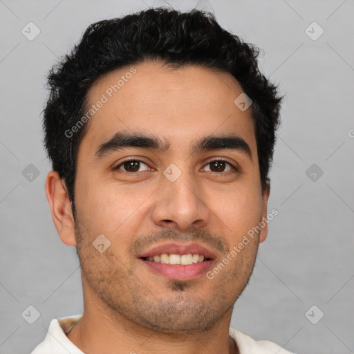 Joyful latino young-adult male with short  brown hair and brown eyes