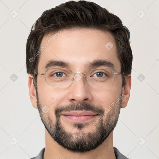 Joyful white young-adult male with short  black hair and brown eyes