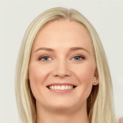 Joyful white young-adult female with long  brown hair and blue eyes