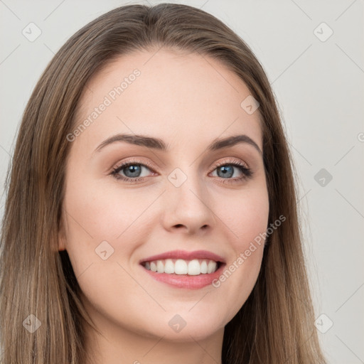 Joyful white young-adult female with long  brown hair and grey eyes