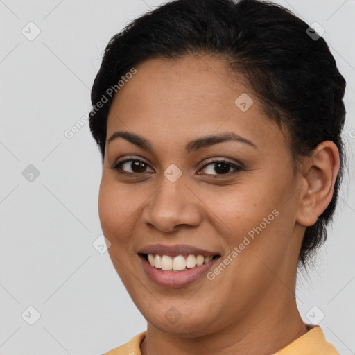 Joyful latino young-adult female with short  brown hair and brown eyes