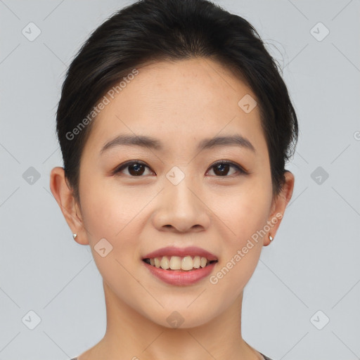 Joyful asian young-adult female with short  brown hair and brown eyes