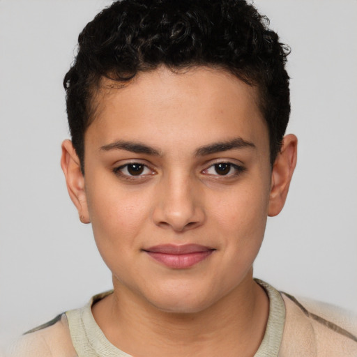 Joyful latino child female with short  brown hair and brown eyes