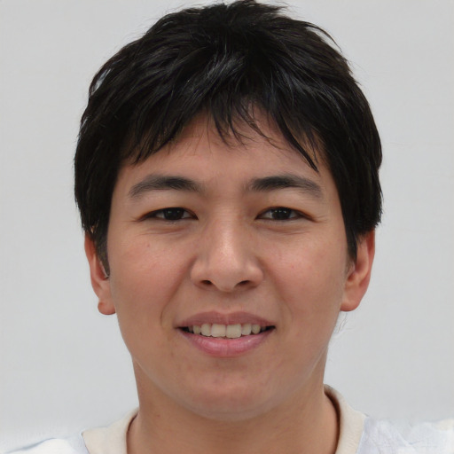 Joyful asian young-adult male with short  brown hair and brown eyes
