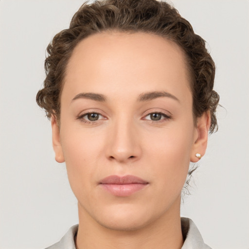 Neutral white young-adult female with short  brown hair and brown eyes