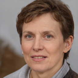 Joyful white adult female with short  brown hair and brown eyes