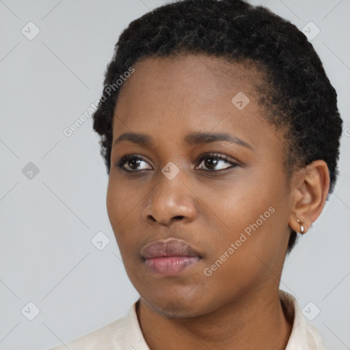 Neutral black young-adult female with short  black hair and brown eyes