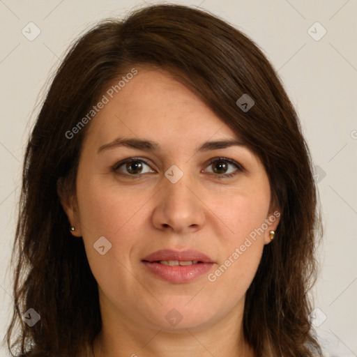 Joyful white adult female with long  brown hair and brown eyes