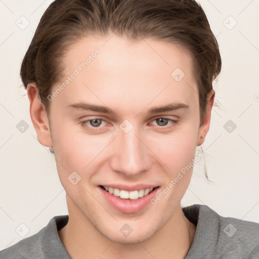 Joyful white young-adult female with short  brown hair and grey eyes