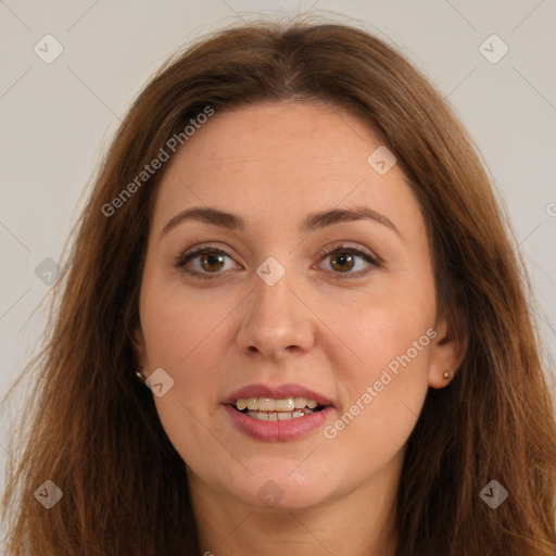 Joyful white adult female with long  brown hair and brown eyes