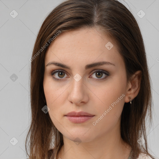 Neutral white young-adult female with long  brown hair and brown eyes