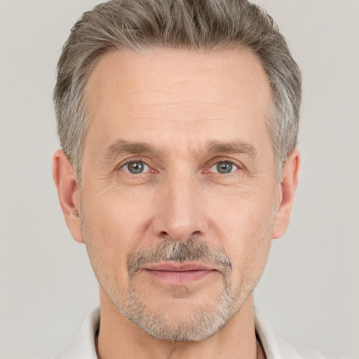 Neutral white middle-aged male with short  gray hair and brown eyes