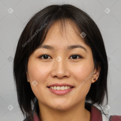 Joyful asian young-adult female with medium  brown hair and brown eyes