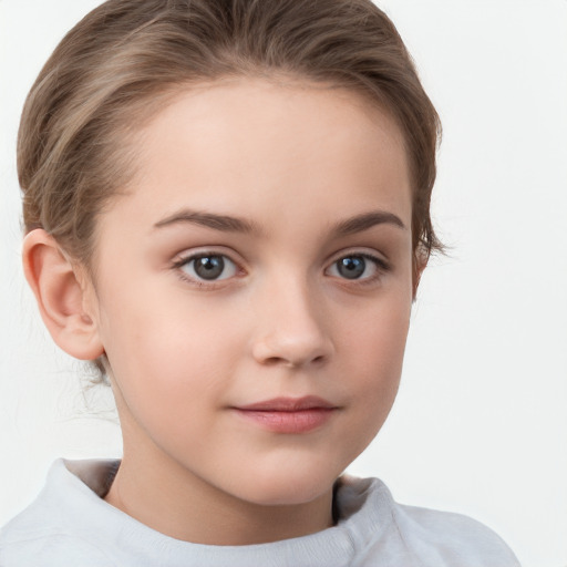 Joyful white child female with short  brown hair and grey eyes