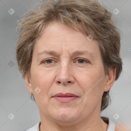 Joyful white middle-aged female with short  brown hair and brown eyes