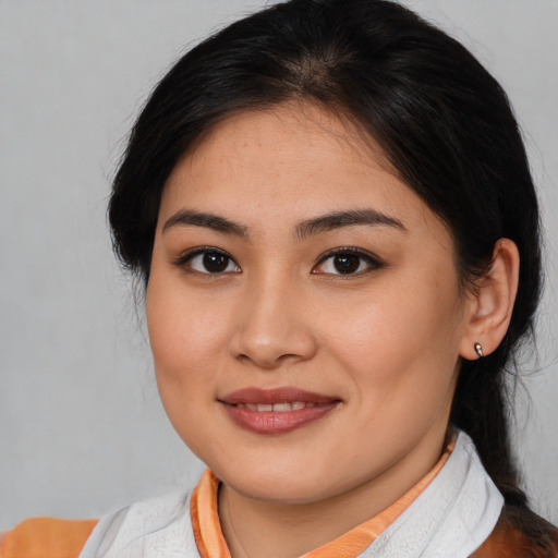 Joyful asian young-adult female with medium  brown hair and brown eyes