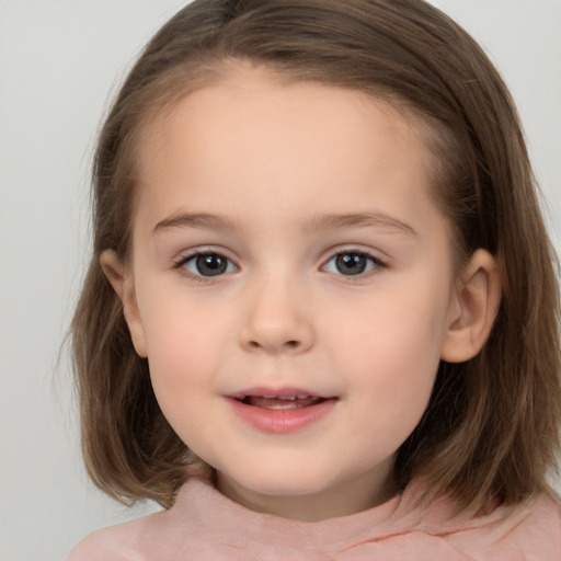 Joyful white child female with medium  brown hair and brown eyes