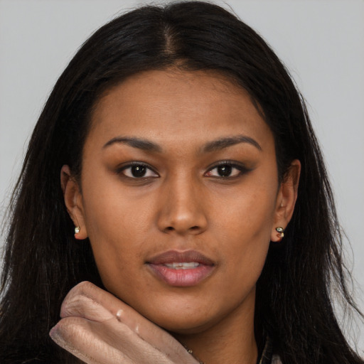 Neutral latino young-adult female with long  brown hair and brown eyes