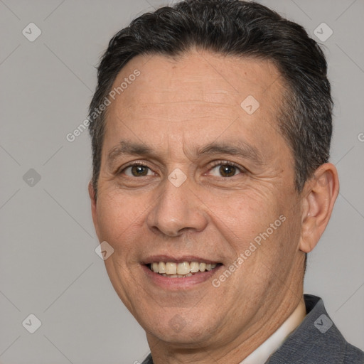 Joyful white adult male with short  brown hair and brown eyes