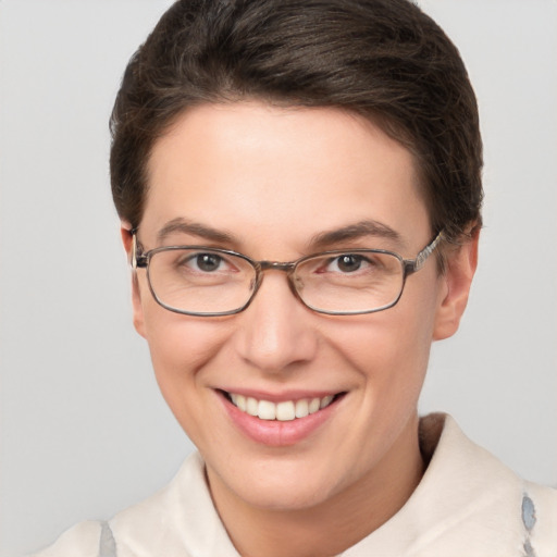 Joyful white young-adult female with short  brown hair and brown eyes