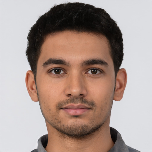 Neutral latino young-adult male with short  black hair and brown eyes