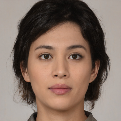 Neutral asian young-adult female with medium  brown hair and brown eyes