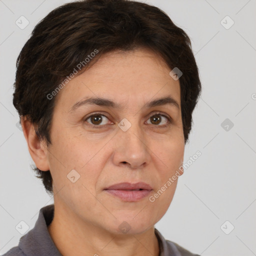 Joyful white adult female with short  brown hair and brown eyes