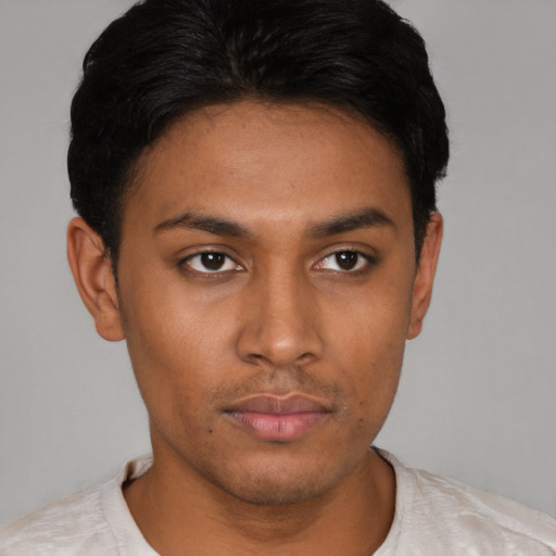 Neutral latino young-adult male with short  black hair and brown eyes