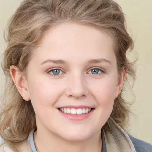 Joyful white young-adult female with medium  brown hair and blue eyes