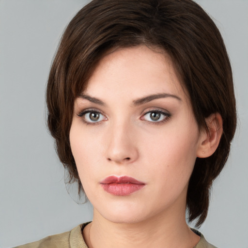 Neutral white young-adult female with medium  brown hair and brown eyes