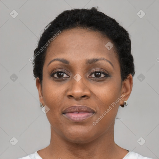 Joyful black young-adult female with short  brown hair and brown eyes