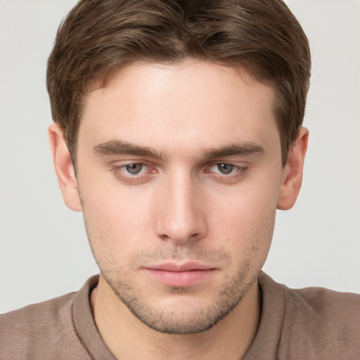 Neutral white young-adult male with short  brown hair and grey eyes